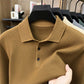 Caramel knit polo collar and three button placket close up with fabric held in hand