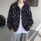 Distressed button shirt with frayed squares showing flecks of colour, loose oversized cut