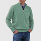 Green mens acrylic knit quarter zip stand collar pullover sweater worn by a standing male model