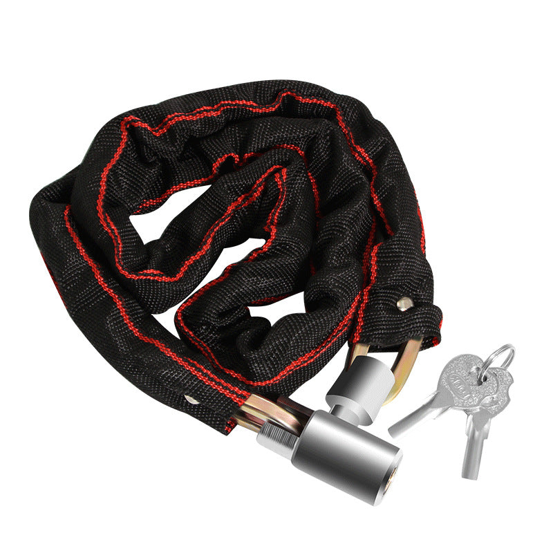 Bicycle chain lock laid out flat to show the full sleeved chain length and barrel lock