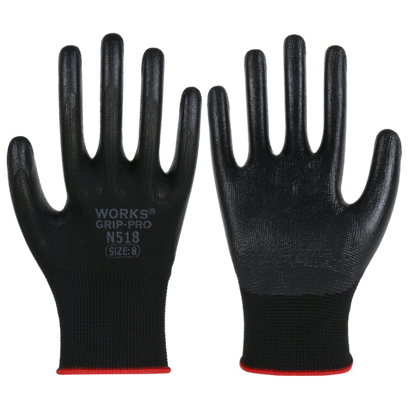 Pair of black nitrile coated work gloves printed WORKS GRIP-PRO N518 with red cuff trim on a white background