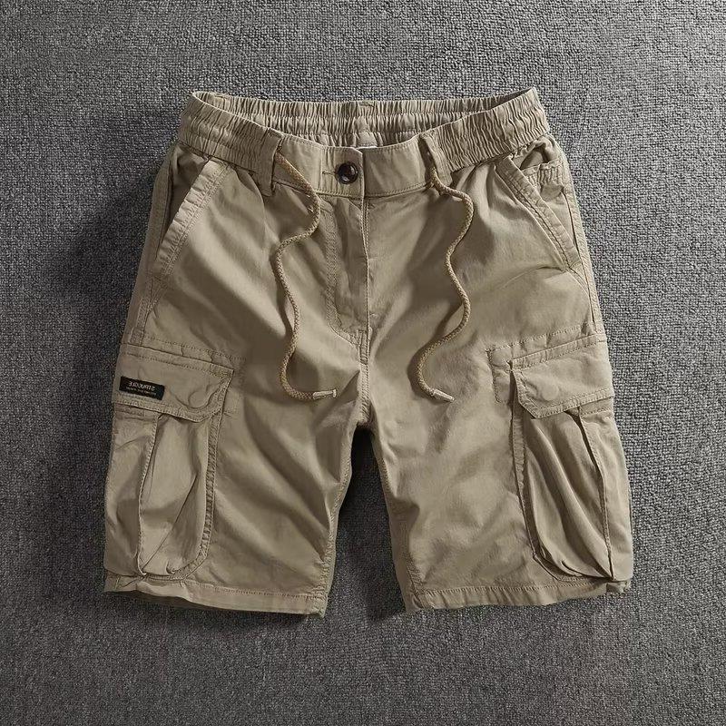 Men's loose fit cargo shorts shown flat with slant hand pockets and side cargo flap pockets