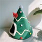 Green and red Christmas tree pet dens shown side by side