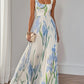 Floral pleated maxi dress styled within a modern interior setting