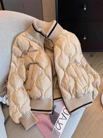 Khaki quilted bomber jacket with a ribbed stand collar, cuffs and hem and a full zip front