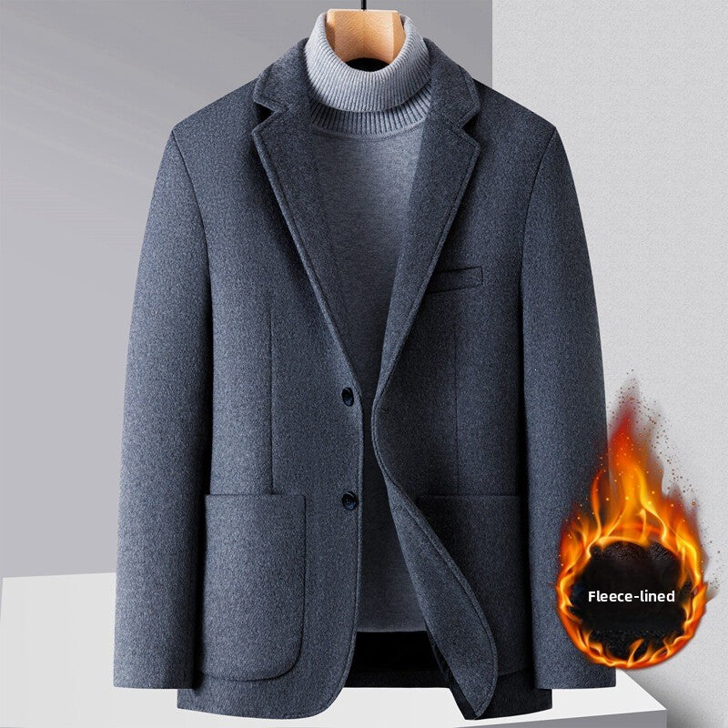 Gray wool blend fleece lined suit jacket shown on a hanger over a knit