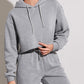 Close-up of the brushed knit fabric and cropped hoodie drawstring hood
