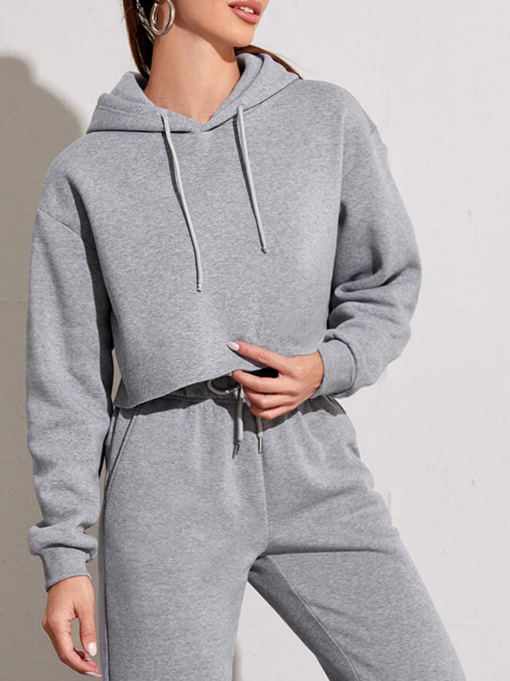 Close-up of the brushed knit fabric and cropped hoodie drawstring hood