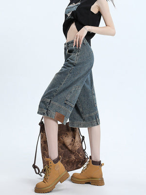High-waist denim shorts, side profile showing the leg and hem