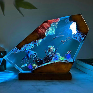 Resin ocean night light glowing blue, octopus and sea turtle scene on a dark wood base
