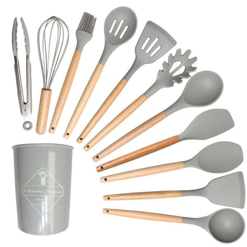 Light gray silicone utensil set spread in a fan beside its matching holder