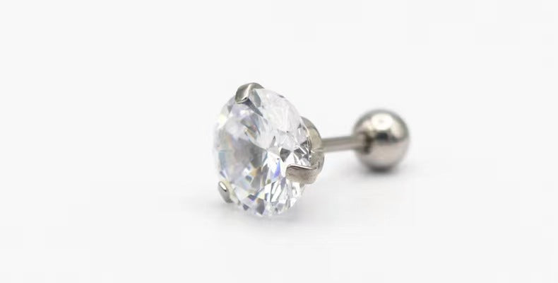 Angled hero shot of faceted zircon stud earrings on stainless steel posts