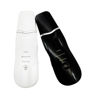 White and black ultrasonic skin scrubber handhelds side by side showing the power key on each body