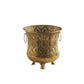 Front view of a retro gold iron flowerpot with openwork pattern, two rings and three feet on white