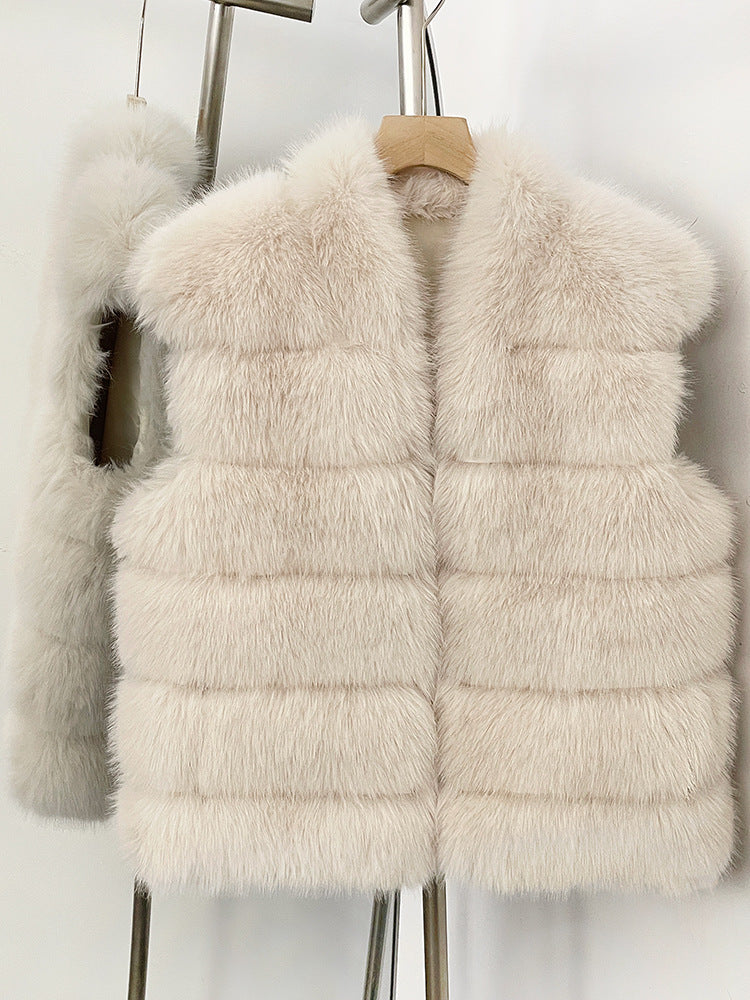 Beige White tiered vegan fur sleeveless vest on a hanger showing six horizontal fur tiers