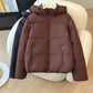 Hooded short puffer jacket with a stand collar and rounded padded silhouette