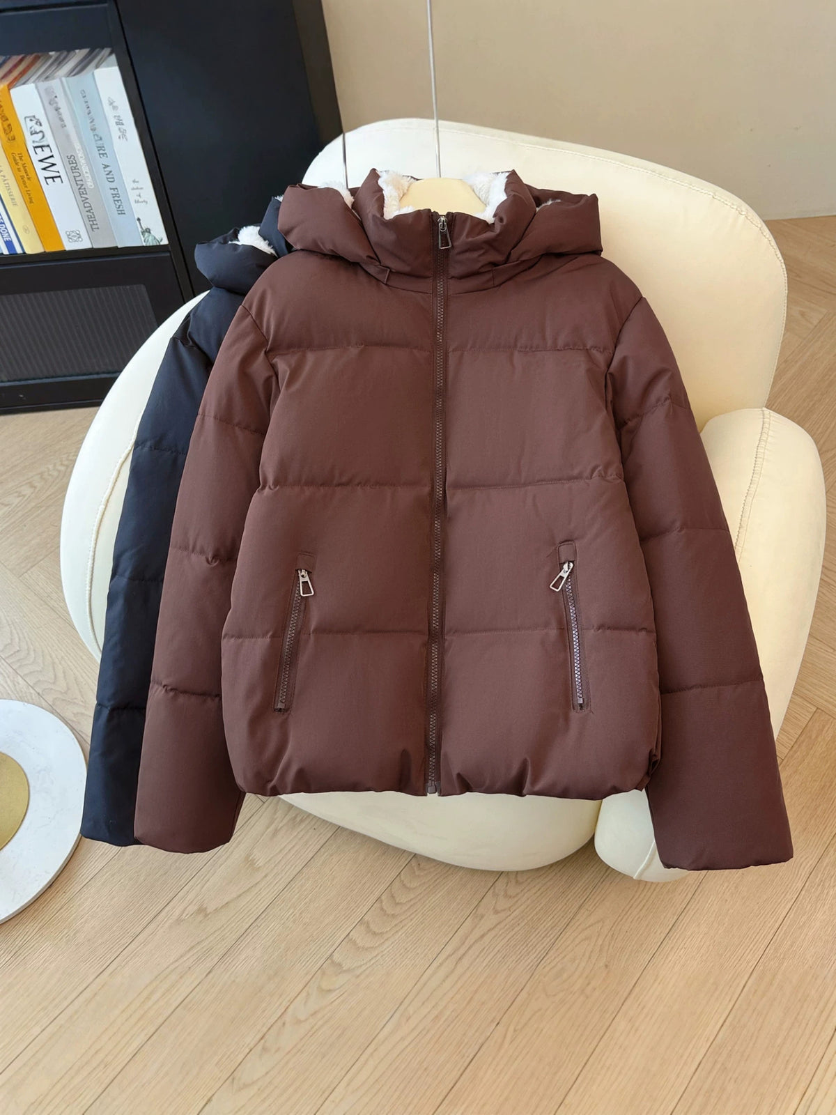 Hooded short puffer jacket with a stand collar and rounded padded silhouette