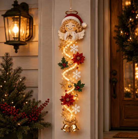 Christmas Angel door hanger with halo, poinsettias and glowing light strands on a porch pillar