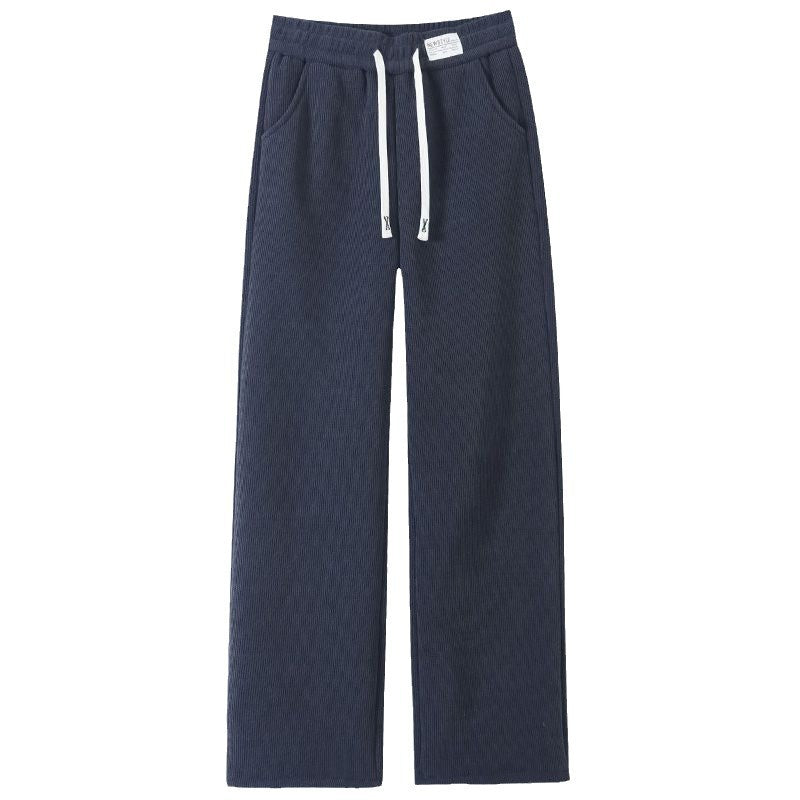 Navy blue ribbed wide leg pants flat view with a white drawstring, woven waist label and side pockets