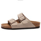 rubber outsole of a pink cork slide sandal seen from below