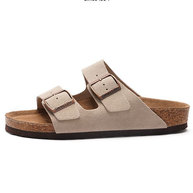 rubber outsole of a pink cork slide sandal seen from below