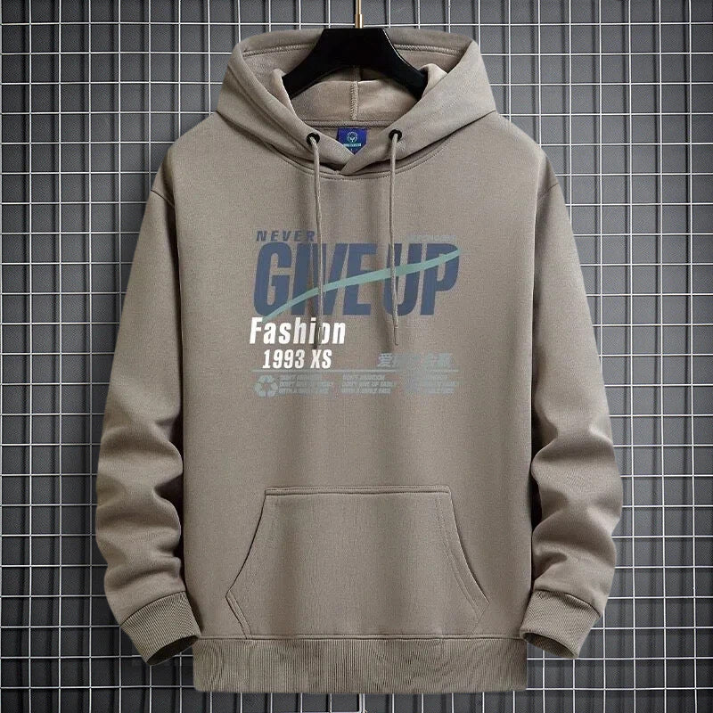Khaki fleece-lined hooded sweatshirt on a hanger with a NEVER GIVE UP print and a front pocket