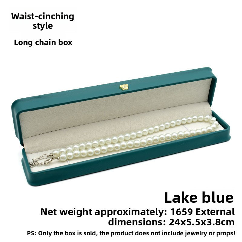 Open lake blue crown clasp necklace box with a pearl necklace, marked size 24 by 5.5 by 3.8 cm