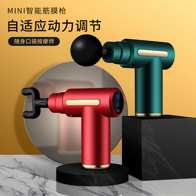 Mini cordless percussion massage gun with an LED screen shown on a marble surface