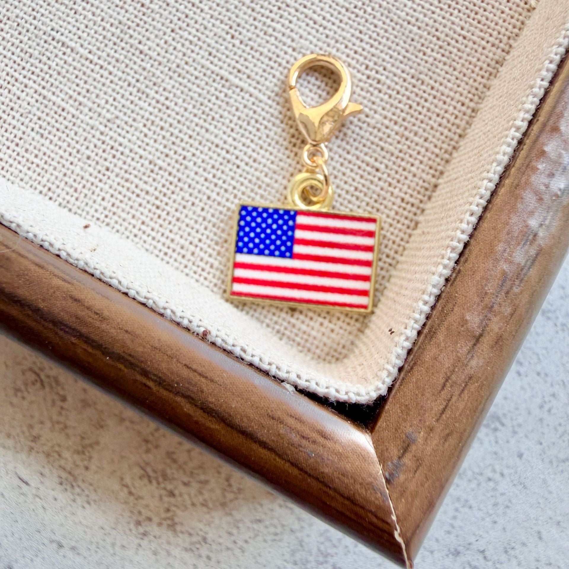 USA enamel country flag keychain charm on a gold tone lobster clasp for keys and bags