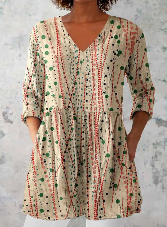 Boho print V neck tunic top with an empire seam and gathered peplum