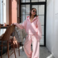 Pink zip-up hoodie and wide leg trousers set worn by a woman, option photo for size S