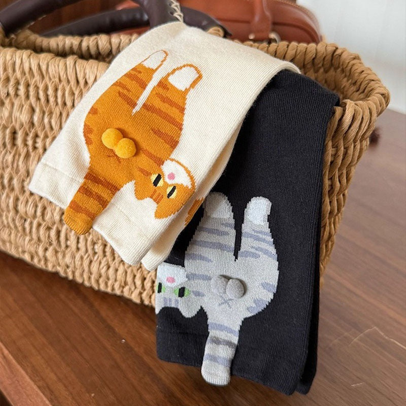 Cream sock showing a ginger tabby cat cartoon with a soft pom pom tail