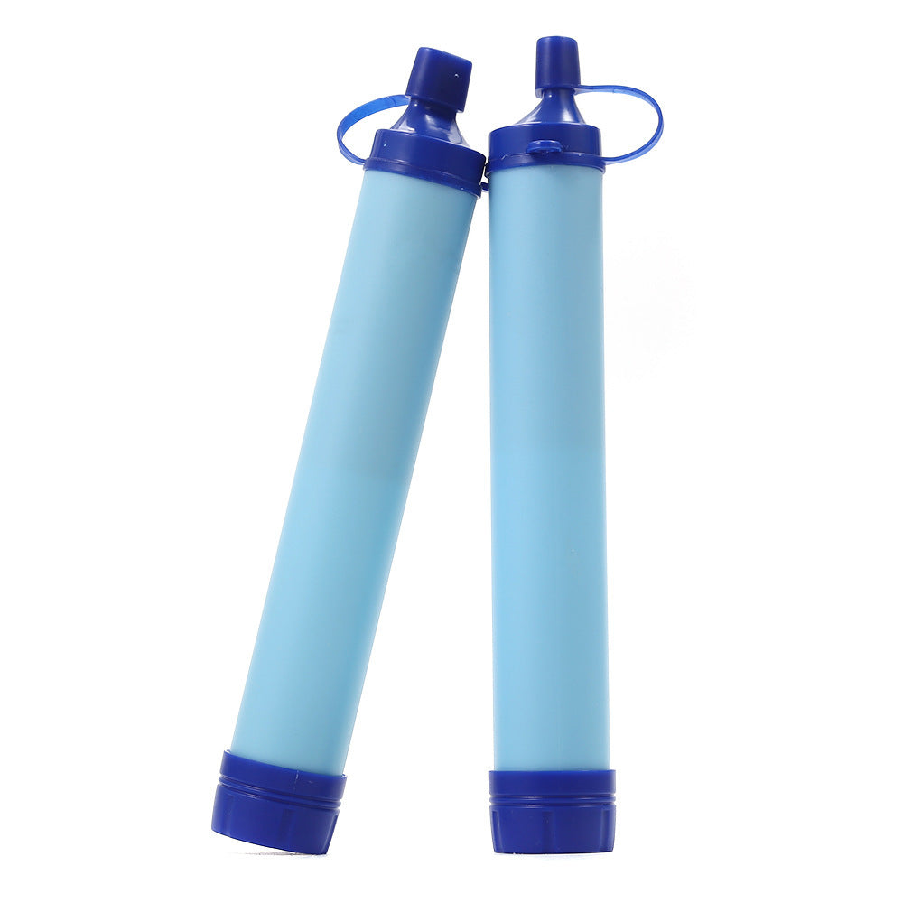 Two blue hollow fibre filter straws standing side by side, mouthpiece caps closed on white