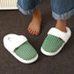 Ribbed velvet indoor slippers with a soft plush lining and an open heel slip on shape