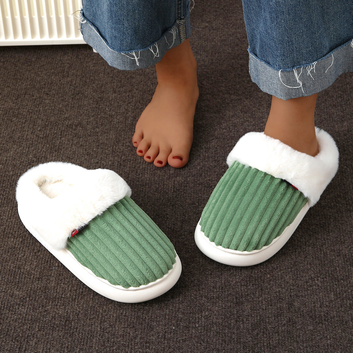 Ribbed velvet indoor slippers with a soft plush lining and an open heel slip on shape