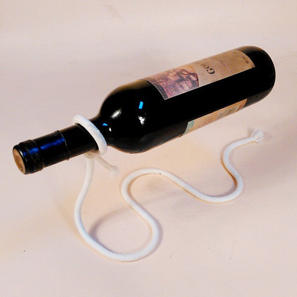 White rope bottle holder with a red wine bottle held level above a pale surface, the White option