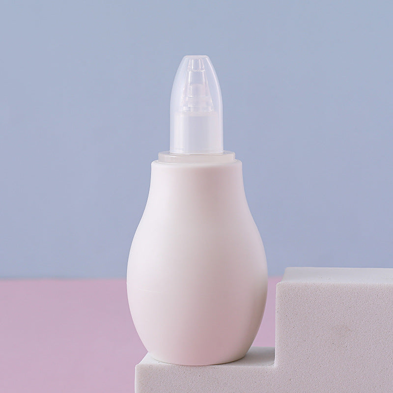 Close view of the soft rounded tip on a pastel manual baby nasal aspirator squeeze bulb