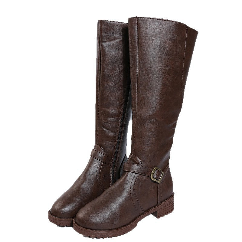 Pair of brown vegan leather knee high riding boots with round toe, ankle buckle strap and low block heel