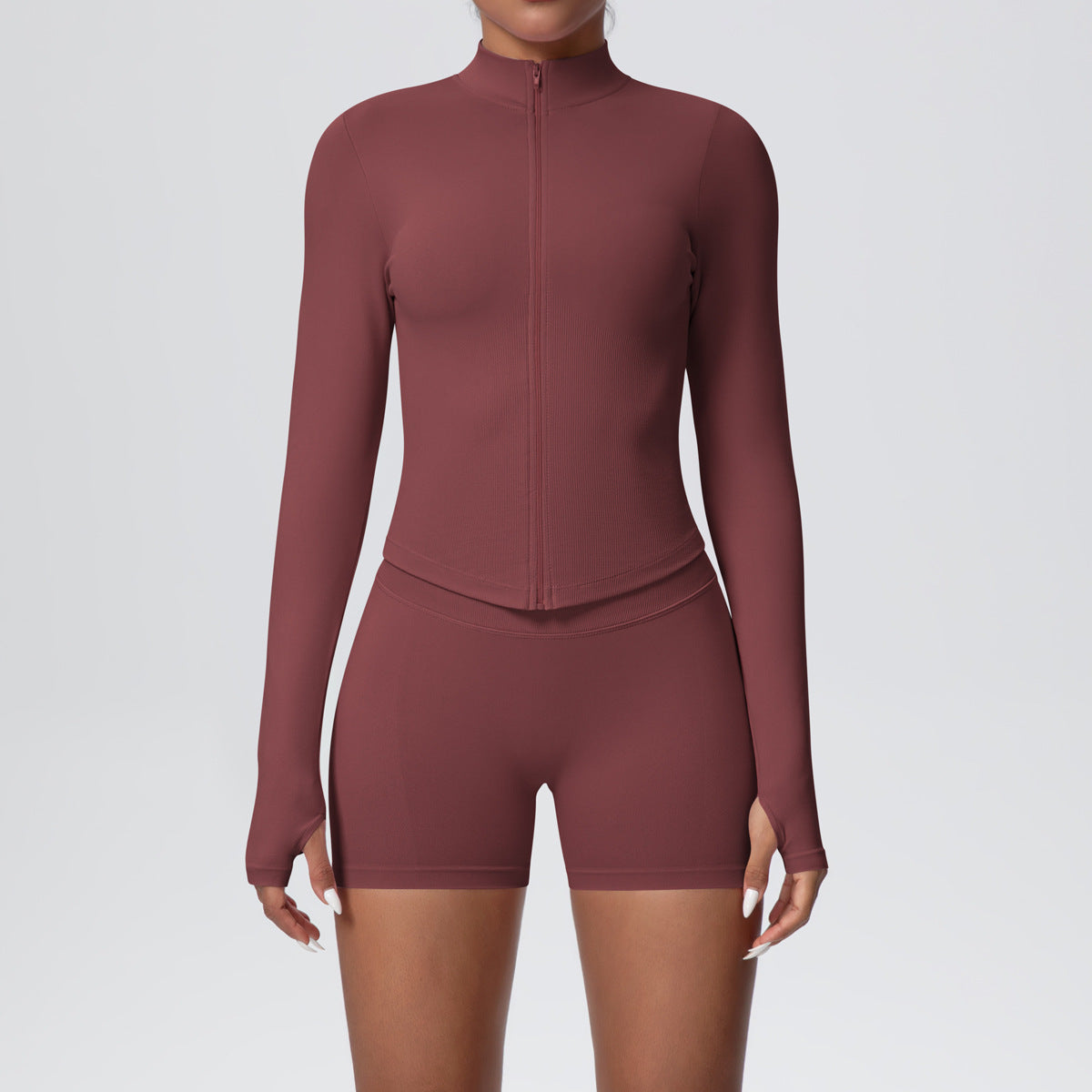 Fitted ribbed seamless zip jacket with a stand collar shown on a female model