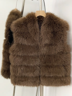 Brown tiered vegan fur sleeveless vest on a wooden hanger with a wide V collar and open front
