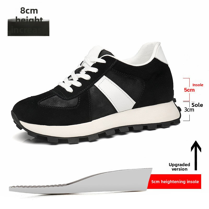 Black cow suede height increasing sneaker with a white stripe and an insole diagram