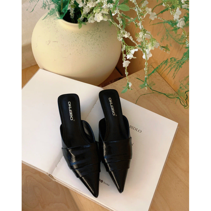 Open back slip on mule showing the exposed heel