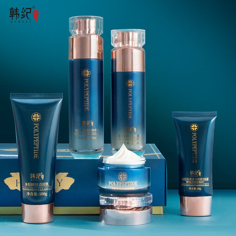 Hankey Polypeptide cleanser tube, essence water bottles, cream jar and BB cream tube on a blue background