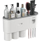 Toothbrush slots under the wall mounted organizer holding several brushes