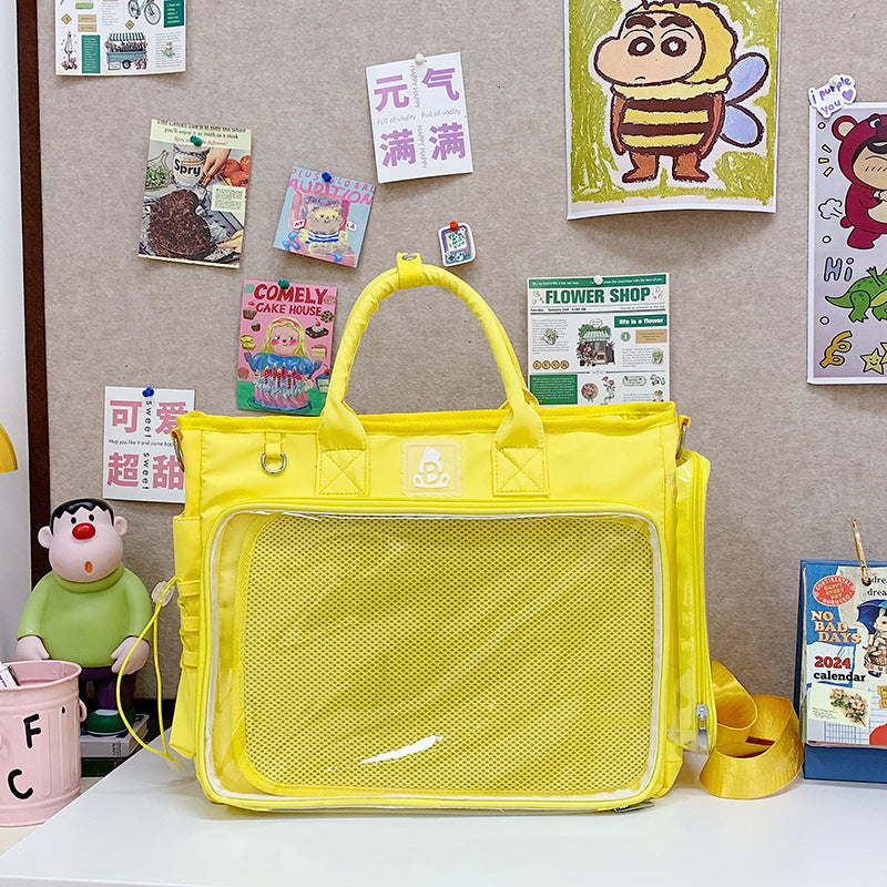 Nylon shoulder bag with a transparent display panel and two top carry handles
