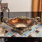 Wood grain resin decor piece trimmed in antiqued gold tone with a cream pearl shell inlay body