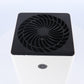 Top view of the dehumidifier black fan grille and touch power button on the white body