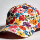 Polyester floral cap with a rounded crown and a short curved shading brim