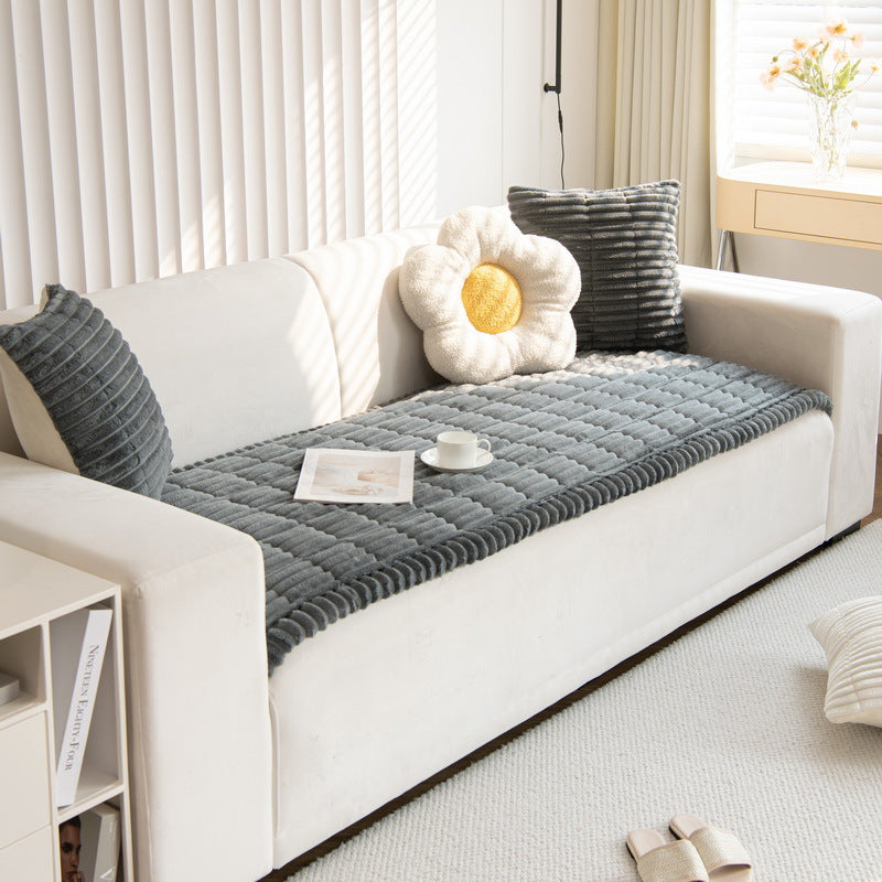 Sweet Serene Dark Gray quilted plush sofa cover on a sofa, 90 x 160 cm