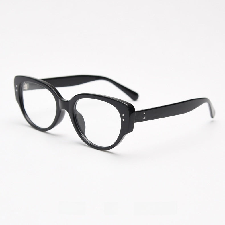 Bright black oval cat eye frame with clear plain lenses seen from the side